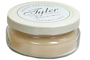 Jar of Tyler candle with a white lid on a white background