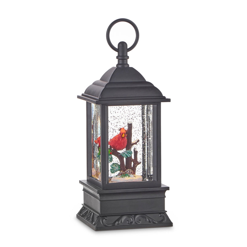 Black lantern-shaped snow globe with a red cardinal design on a white background