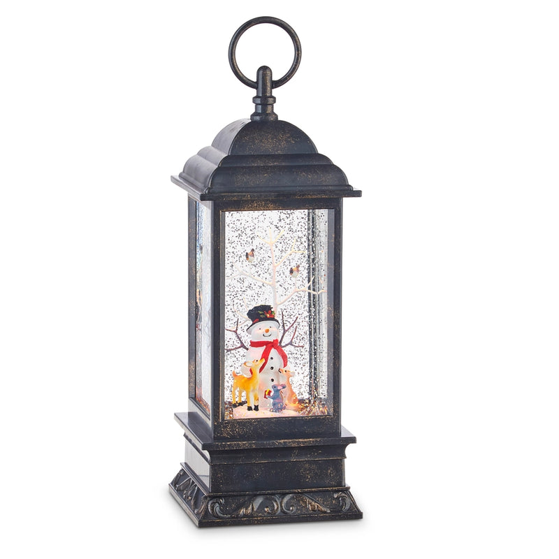 Decorative lantern with a snowman and reindeer scene inside on a white background