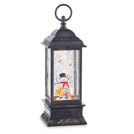 Decorative lantern with a snowman and reindeer scene inside on a white background
