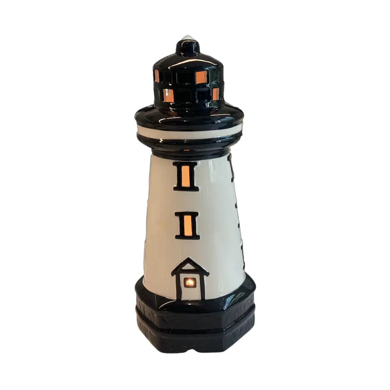 Decorative lighthouse-shaped lamp on a white background