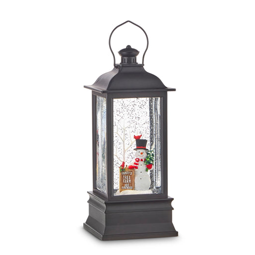Black lantern with a snowman inside on a white background