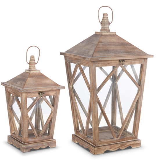 Two wooden lanterns with geometric designs on a white background