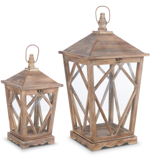Two wooden lanterns with geometric designs on a white background