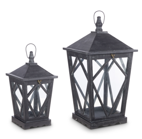 Two black lanterns with geometric designs on a white background