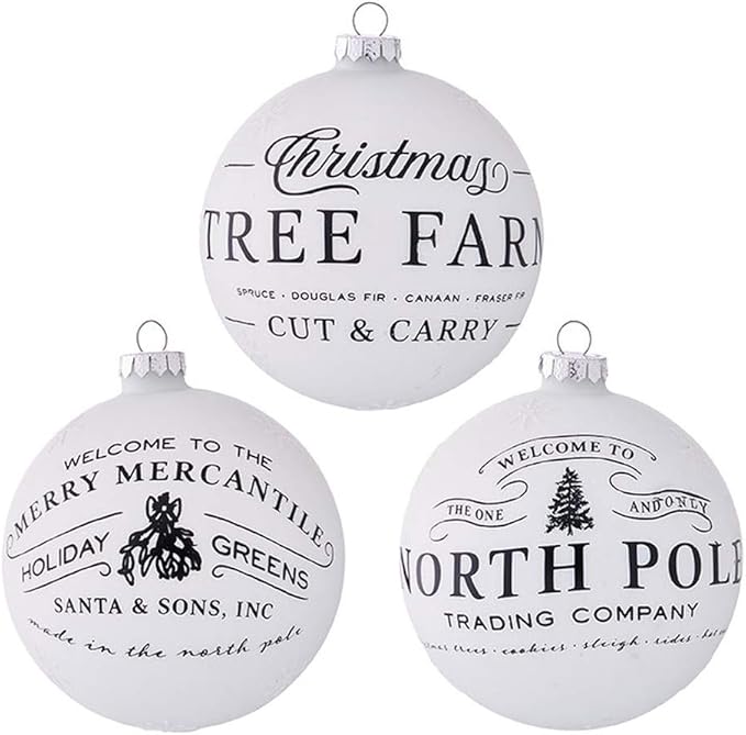 Three white Christmas ornaments with black text and graphics on a white background