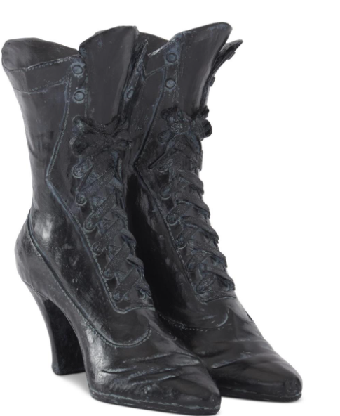 Pair of black lace-up boots on a white background