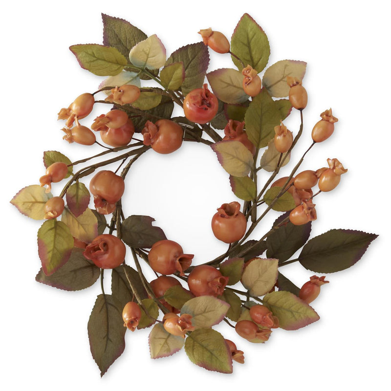 Decorative wreath with autumnal fruits and leaves on a white background
