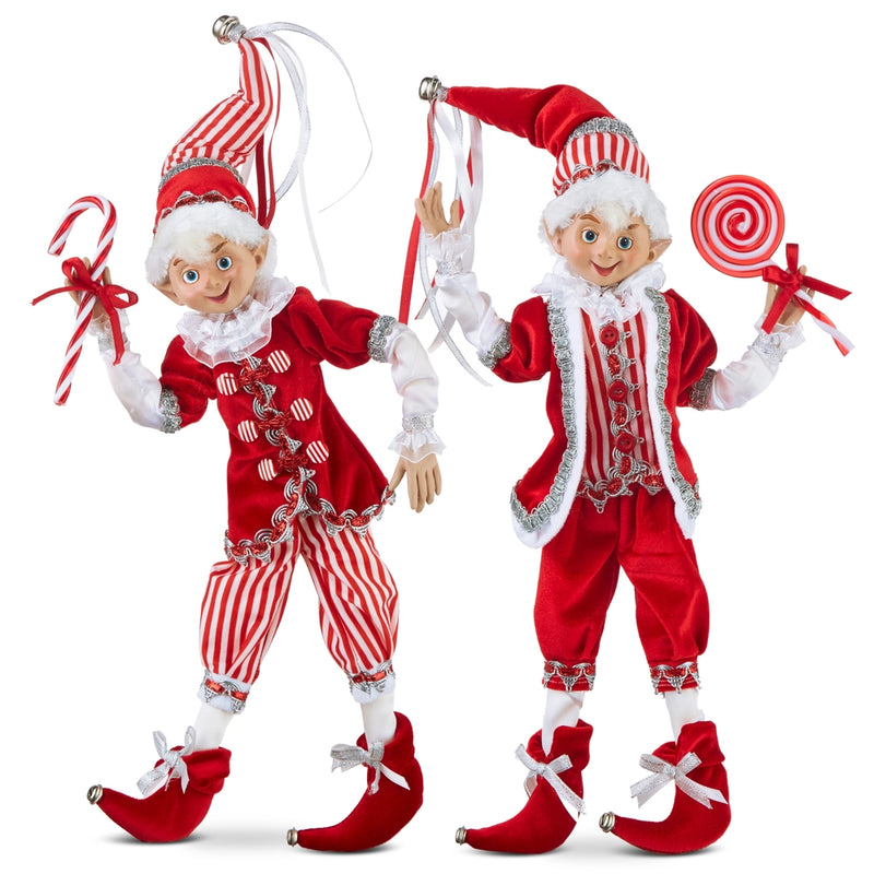 Two Christmas elves in red and white outfits with candy canes and lollipops on a white background.
