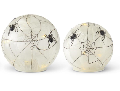 Two spherical Halloween decorations with spider webs and spiders on a white background