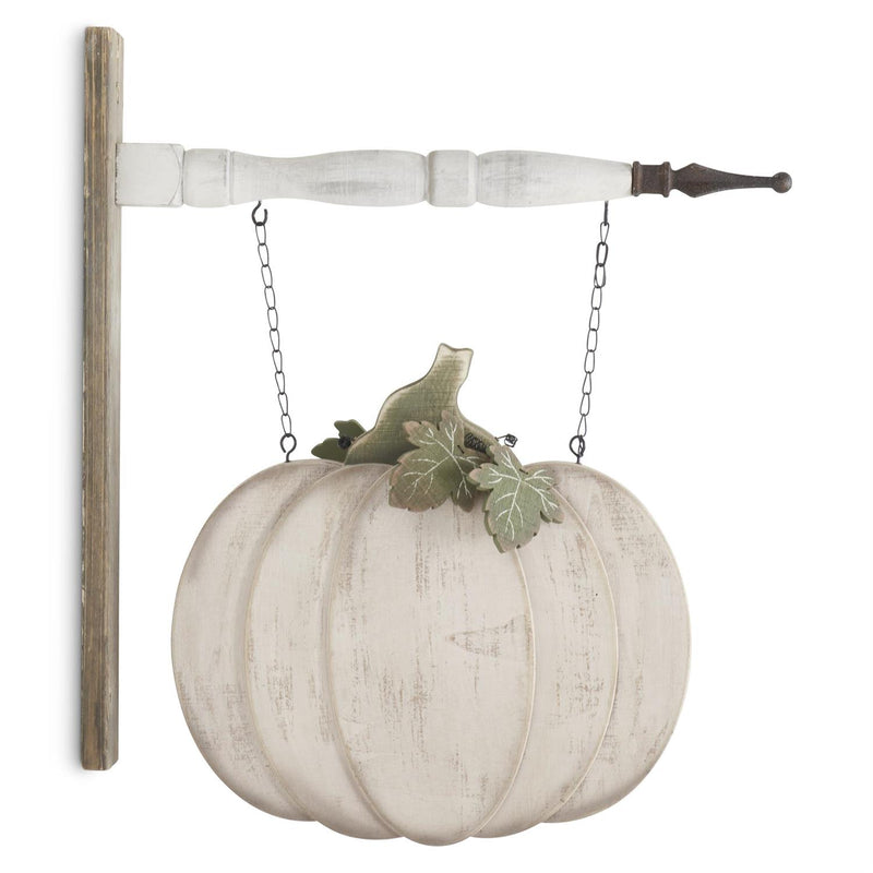 Decorative white pumpkin hanging from a wooden bracket with a white background