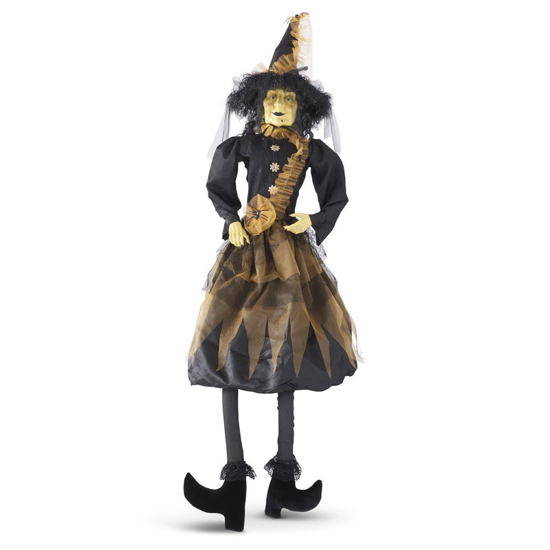 Halloween-themed doll with black and gold outfit on a white background