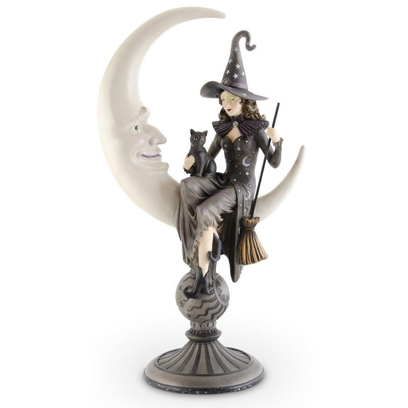 Statue of a witch sitting on a moon with a cat, on a white background