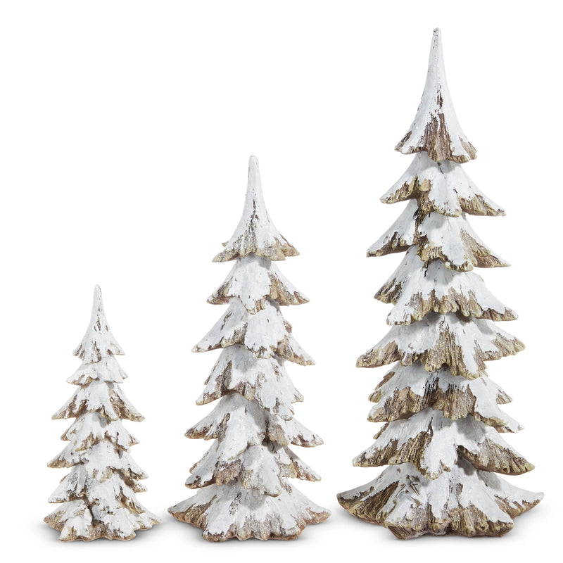 Set of three decorative Christmas trees with snow effect on a white background