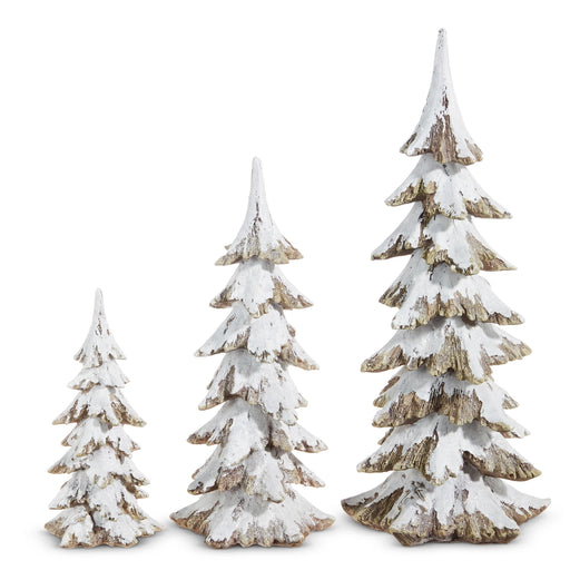 Set of three decorative Christmas trees with snow effect on a white background