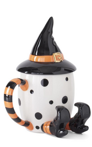 Halloween-themed mug with witch hat, polka dot body, and legs on a white background