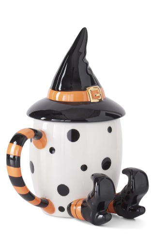 Halloween-themed mug with witch hat, polka dot body, and legs on a white background