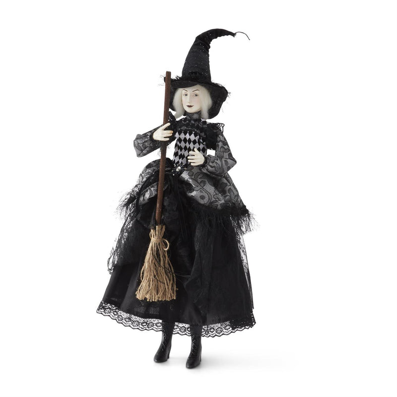 Halloween witch doll with a broom on a white background