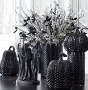 Halloween-themed decorations with skeletons, pumpkins, and decorative elements on a white background.