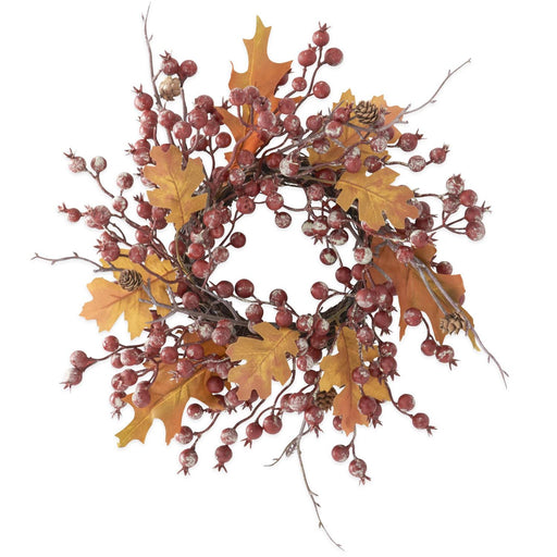Decorative wreath with autumn leaves and berries on a white background