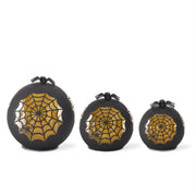 Three black decorative pumpkins with gold spider webs on a white background