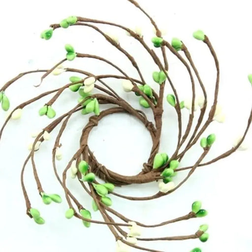 Decorative wreath with green and white berries on a white background