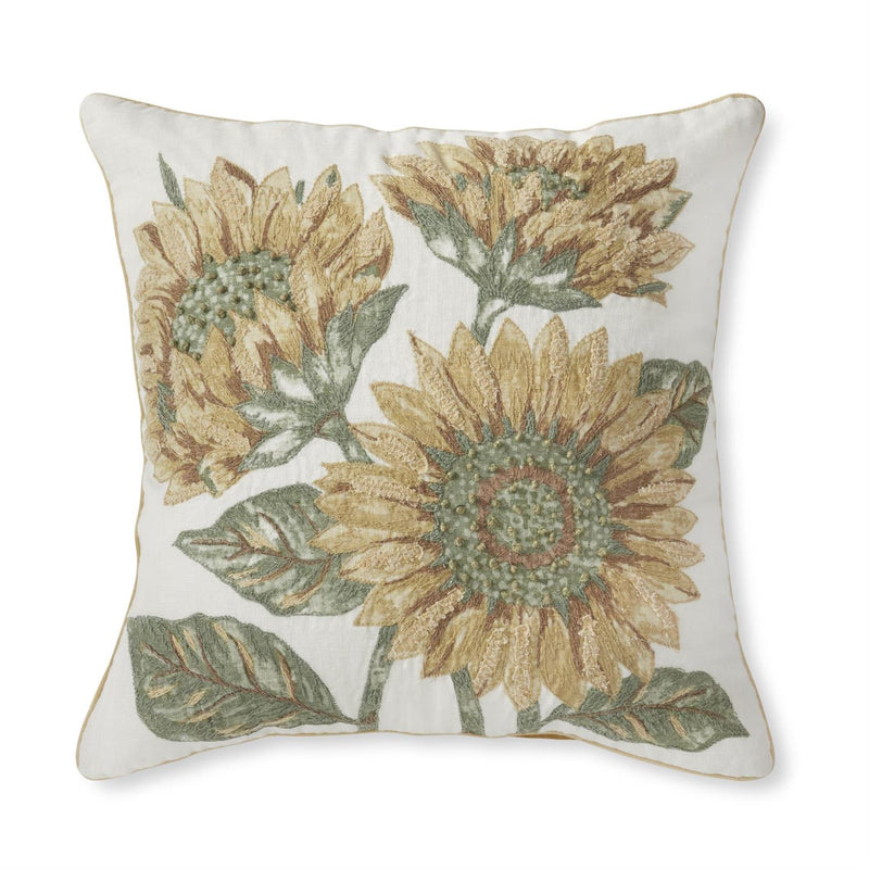 Decorative pillow with sunflower pattern on a white background