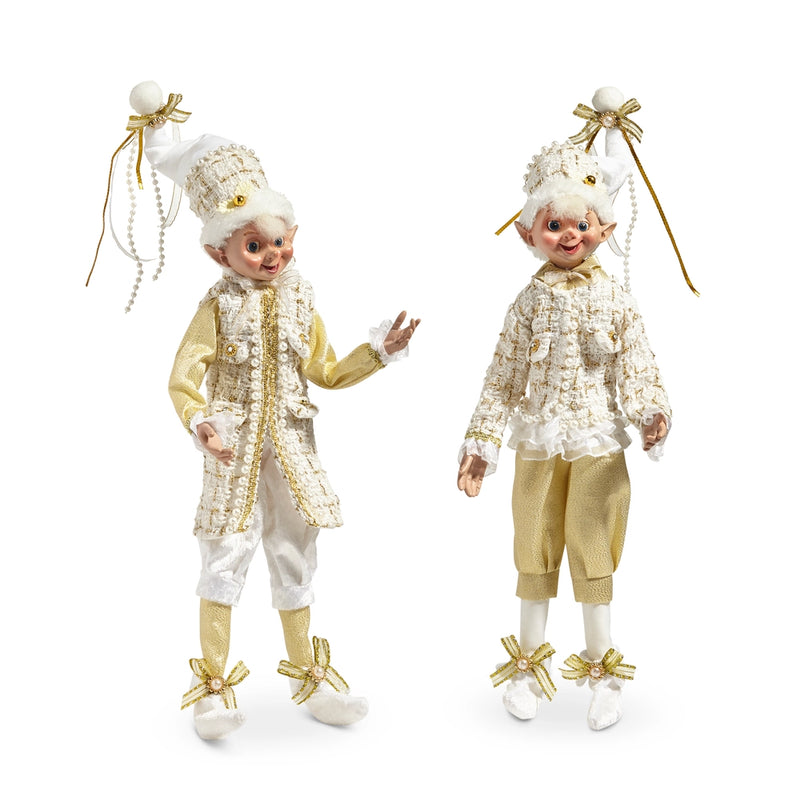 Two decorative elves in gold and white outfits on a white background