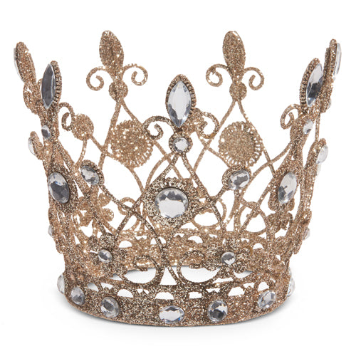 Gold crown with rhinestones on a white background