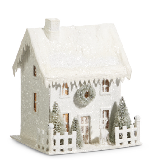 Decorative white house with snow effect on a white background