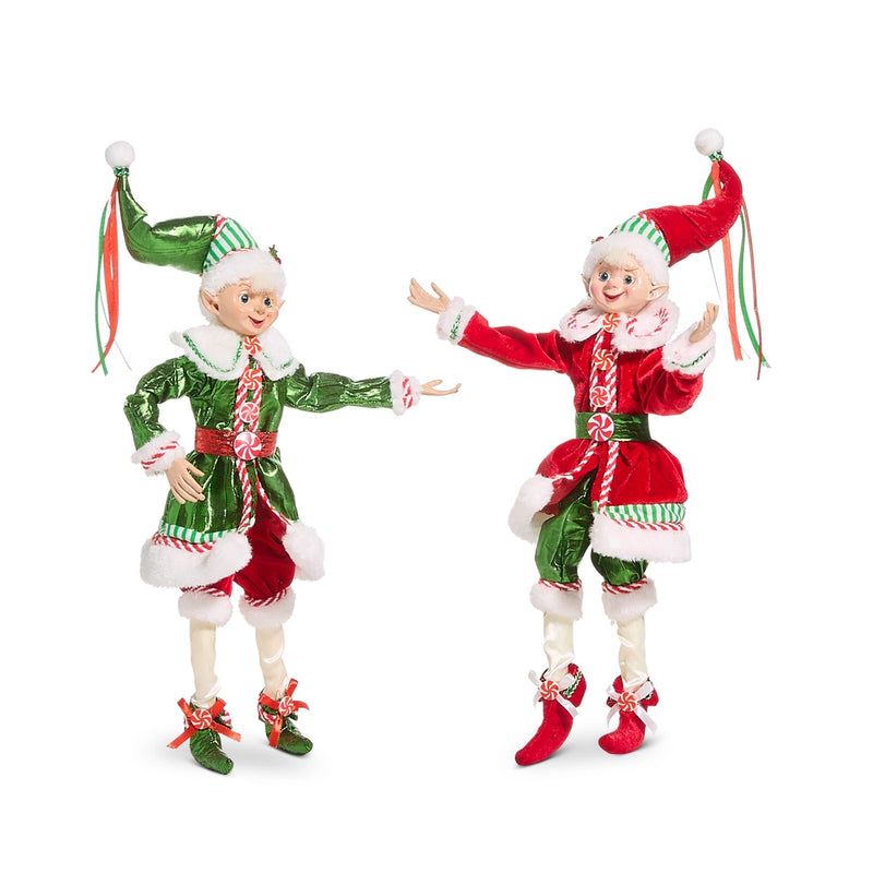 Two Christmas elves in red and green outfits on a white background