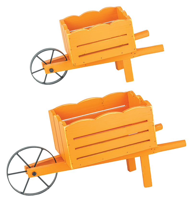 Two orange wooden wheelbarrow planters with scalloped front edges and black metal wheels, shown on a plain white background.