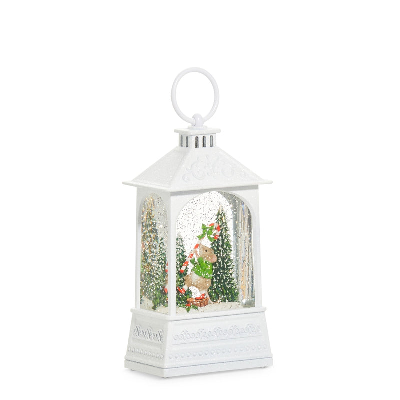 White lantern-shaped snow globe with a deer and trees inside on a white background