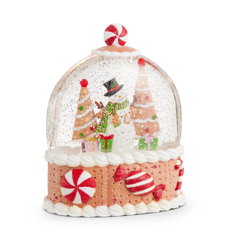Christmas-themed snow globe with gingerbread house design on a white background