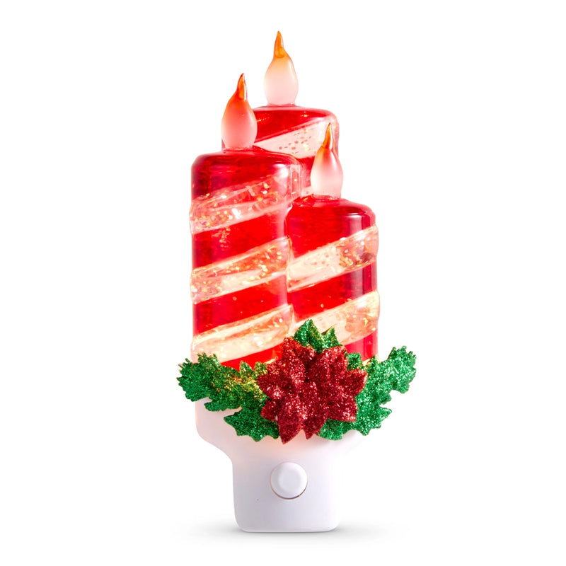 Decorative night light with candy cane design and holly leaves on a white background