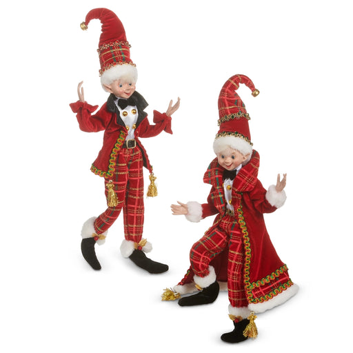 Two Christmas elves in red and plaid outfits on a white background