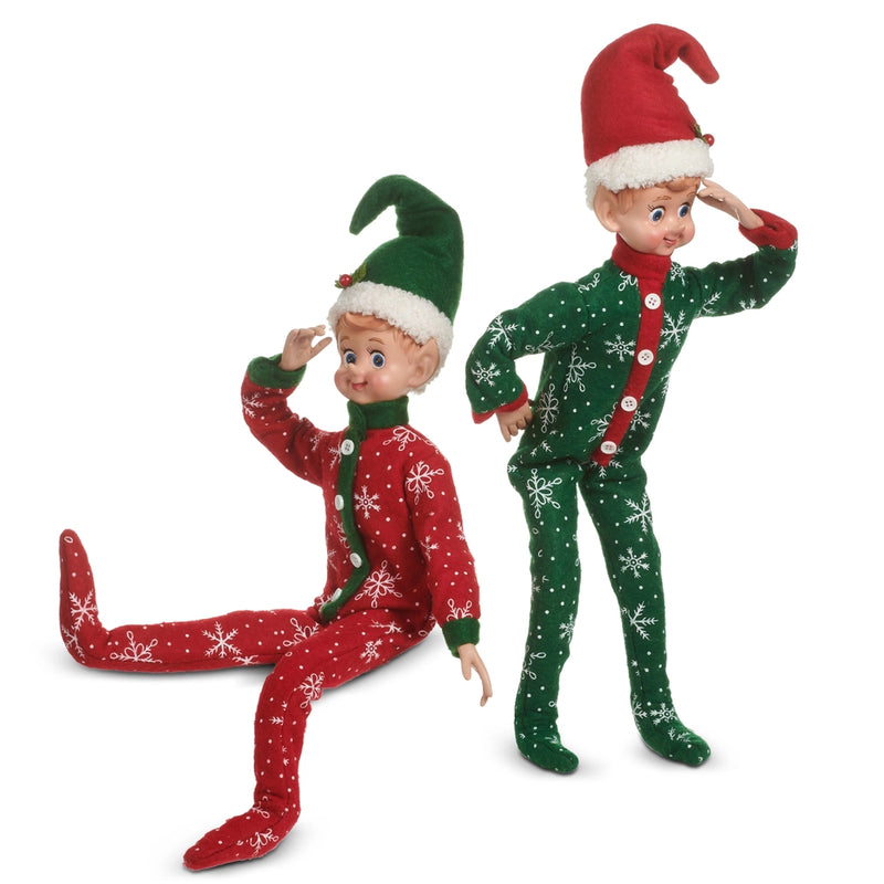 Two Christmas elves in red and green outfits with snowflake patterns on a white background.