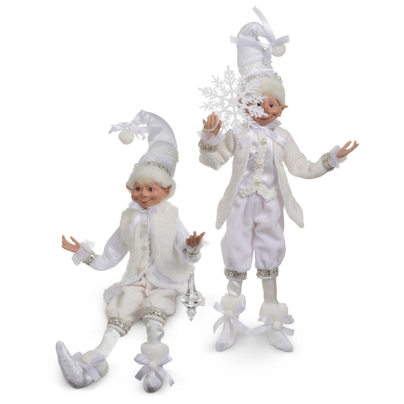 Two white elves in festive outfits on a white background