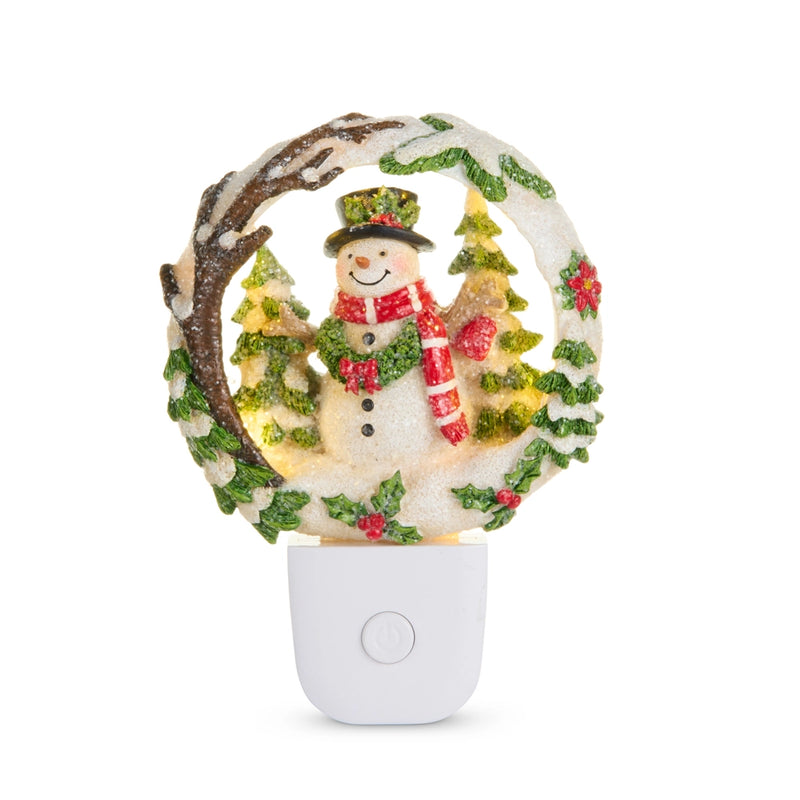 Decorative night light with a snowman and wreath design on a white background