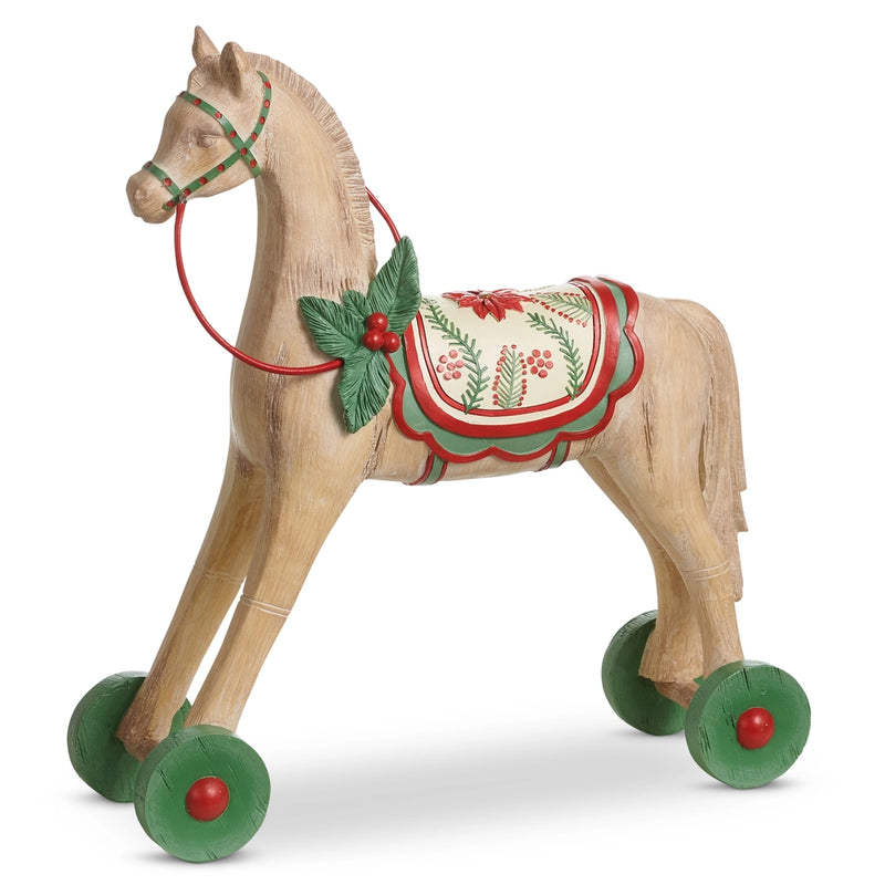 Wooden horse toy with wheels and festive decorations on a white background
