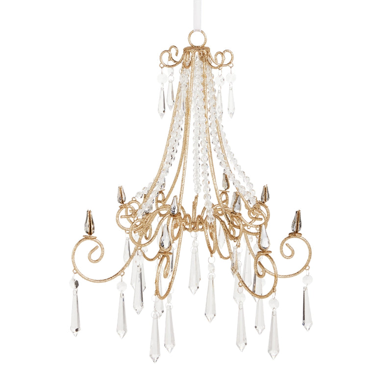 Gold chandelier with crystal accents on a white background