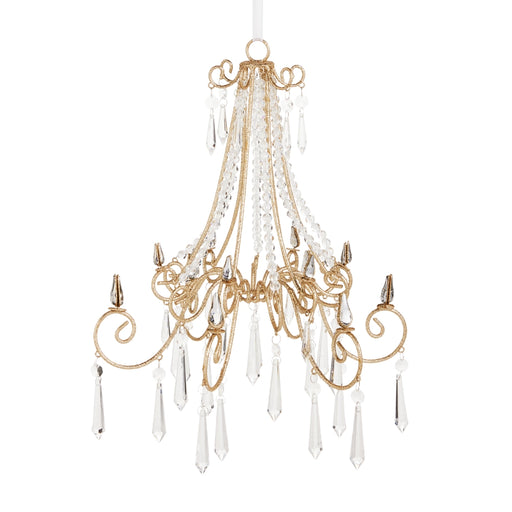 Gold chandelier with crystal accents on a white background