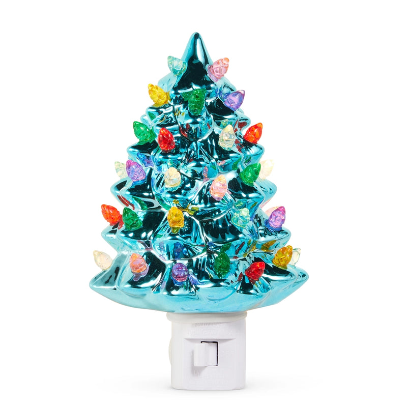 Colorful Christmas tree night light with a white base on a white background
