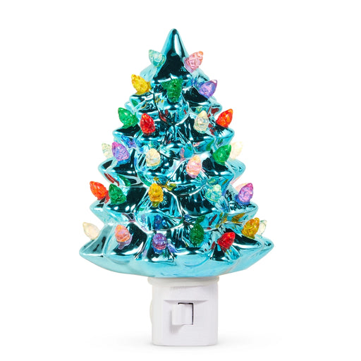 Colorful Christmas tree night light with a white base on a white background