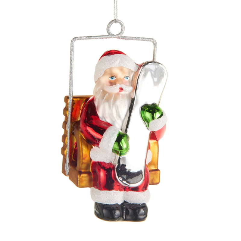 Glass ornament of Santa Claus with candy cane and presents on a white background