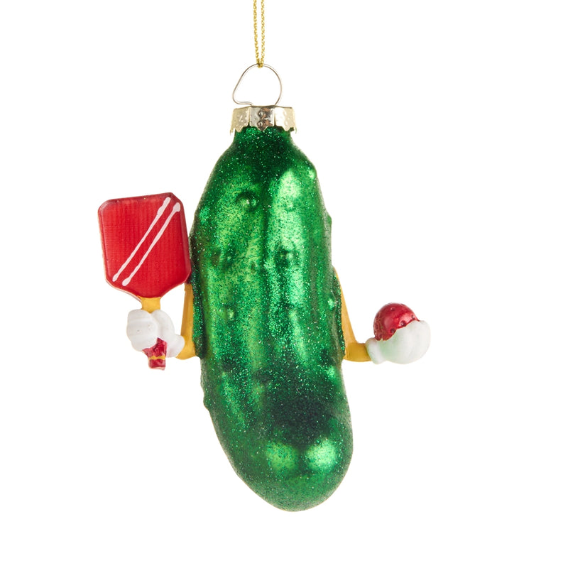 Green pickle ornament with small Santa hats and a red flag on a white background