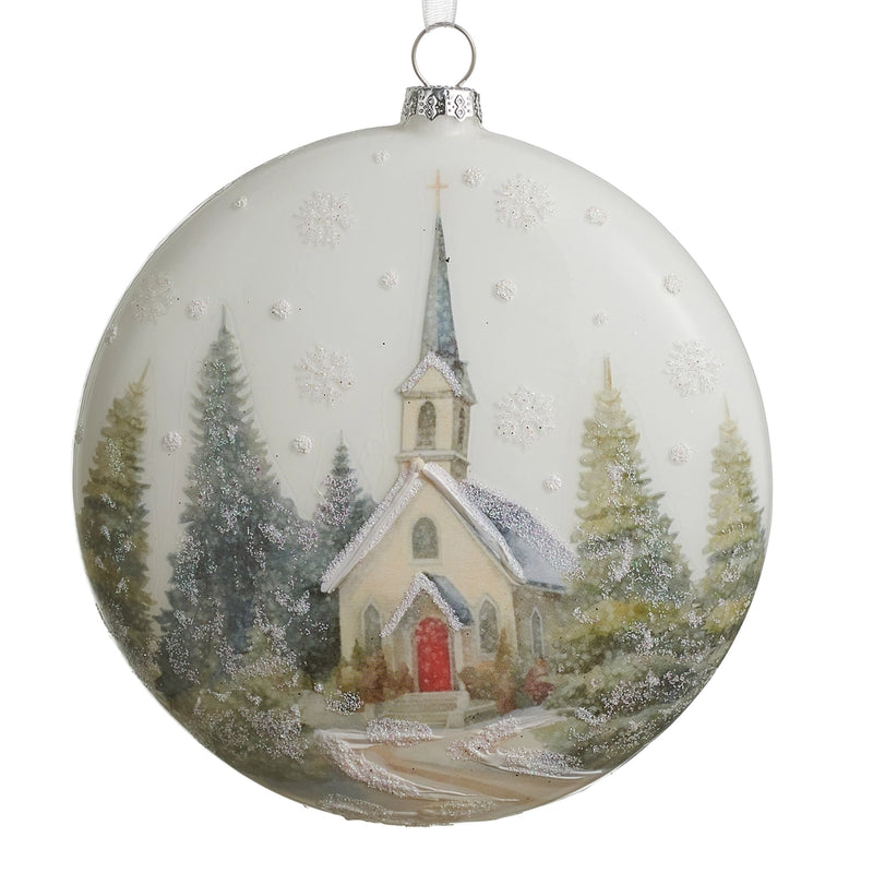 Christmas ornament with a snowy village scene featuring a church.