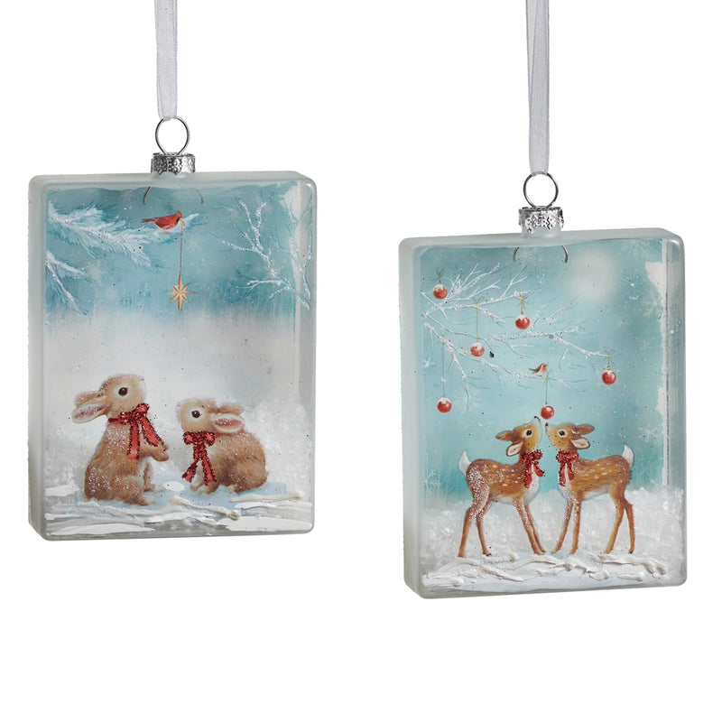 Two rectangular glass Christmas ornaments with winter scenes of rabbits and deer.