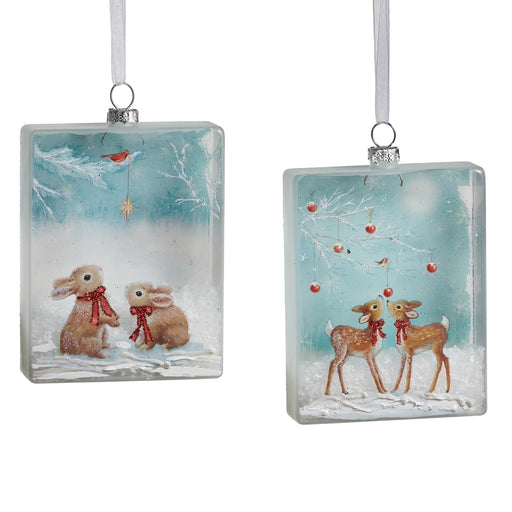Two rectangular glass Christmas ornaments with winter scenes of rabbits and deer.