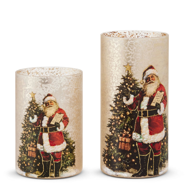 Two decorative candles with Santa Claus and Christmas trees on a white background